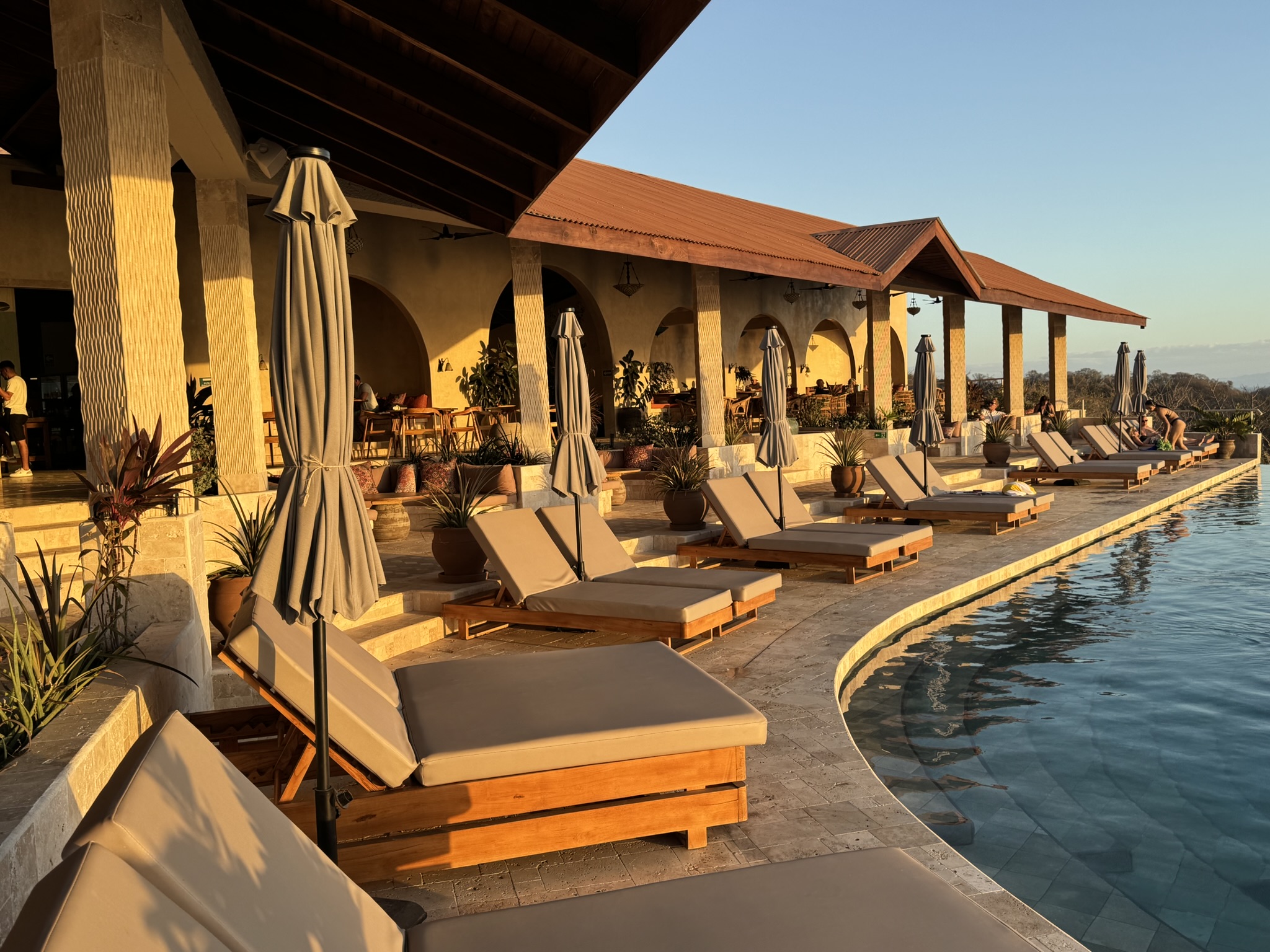 Poolside lounge chairs overlooking the venue