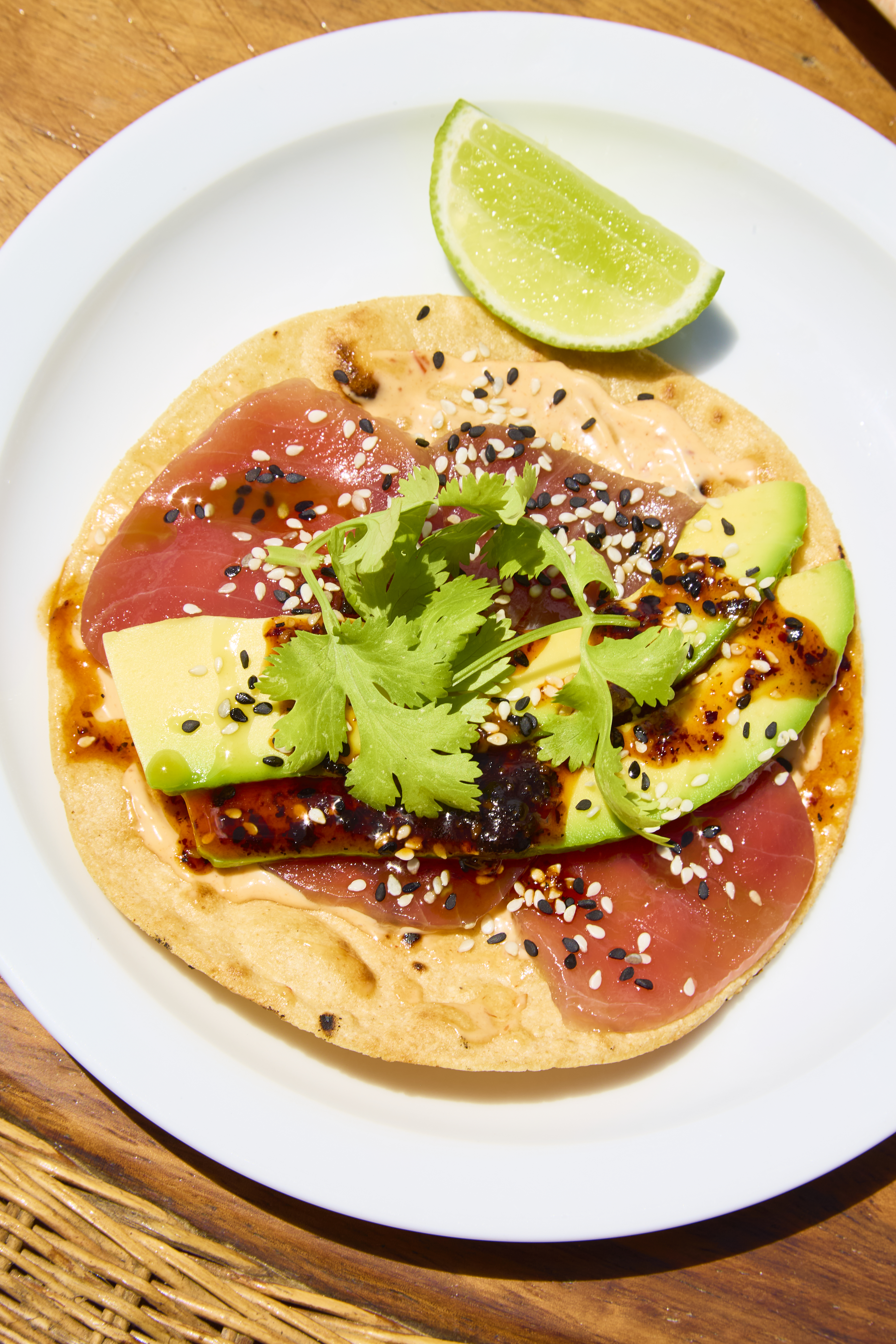 Tuna tostada with avocado, sesame, and lime
